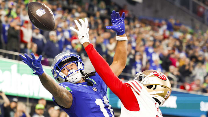 Oct 10, 2024; Seattle, Washington, USA; San Francisco 49ers cornerback Deommodore Lenoir (2) breaks a up a potential touchdown pass to Seattle Seahawks wide receiver Jaxon Smith-Njigba (11) during the second quarter at Lumen Field. Oct 10, 2024; Seattle, Washington, USA; San Francisco 49ers cornerback Deommodore Lenoir (2) breaks a up a potential touchdown pass to Seattle Seahawks wide receiver Jaxon Smith-Njigba (11) during the second quarter at Lumen Field.