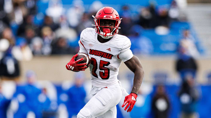 Nov 30, 2024; Lexington, Kentucky, USA; Louisville Cardinals running back Isaac Brown (25) runs the ball during the third quarter against the Kentucky Wildcats at Kroger Field. Nov 30, 2024; Lexington, Kentucky, USA; Louisville Cardinals running back Isaac Brown (25) runs the ball during the third quarter against the Kentucky Wildcats at Kroger Field.