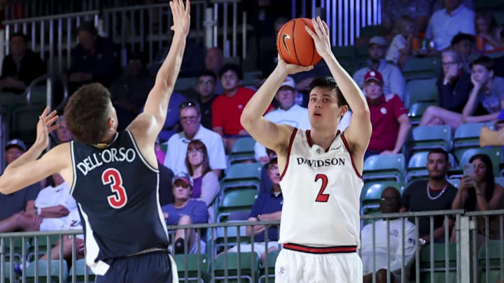 Nov 27, 2024; Paradise Island, Bahamas, BHS; Davidson Wildcats forward Bobby Durkin (2) shoots as Arizona Wildcats guard Anthony Dell'Orso (3) defends during the first half at the Atlantis Resort. Nov 27, 2024; Paradise Island, Bahamas, BHS; Davidson Wildcats forward Bobby Durkin (2) shoots as Arizona Wildcats guard Anthony Dell'Orso (3) defends during the first half at the Atlantis Resort.
