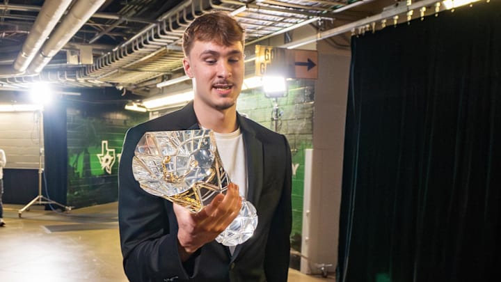 Apr 29, 2026; Dallas, TX, USA;  Dallas Maverick Cooper Flagg makes his way to post press conference gathering in his honor for being named the 2025-26 NBA Rookie of the Year at American Airlines Center. Mandatory Credit: Raymond Carlin III-Imagn Images