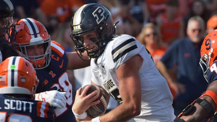 Purdue Boilermakers quarterback Ryan Browne (15) runs with the ball Purdue Boilermakers quarterback Ryan Browne (15) runs with the ball