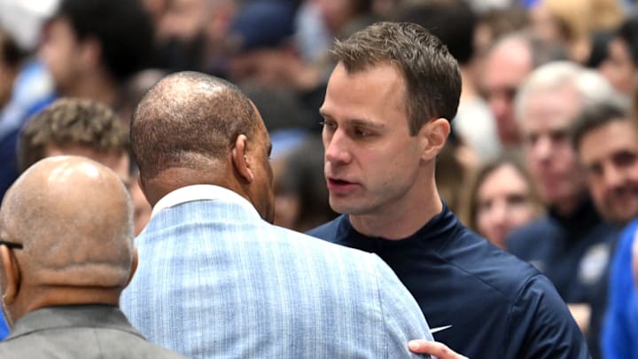 Feb 1, 2025; Durham, North Carolina, USA; Duke Blue Devils head coach Jon Scheyer and North Carolina Tar Heels head coach Hubert Davis shake hands before a game at Cameron Indoor Stadium. Mandatory Credit: Zachary Taft-Imagn Images Feb 1, 2025; Durham, North Carolina, USA; Duke Blue Devils head coach Jon Scheyer and North Carolina Tar Heels head coach Hubert Davis shake hands before a game at Cameron Indoor Stadium. Mandatory Credit: Zachary Taft-Imagn Images