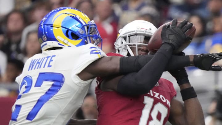 Arizona Cardinals wide receiver Marvin Harrison Jr. (18) catches a touchdown against Los Angeles Rams cornerback Tre'Davious White (27) during the first quarter at State Farm Stadium on Sept. 15, 2024.