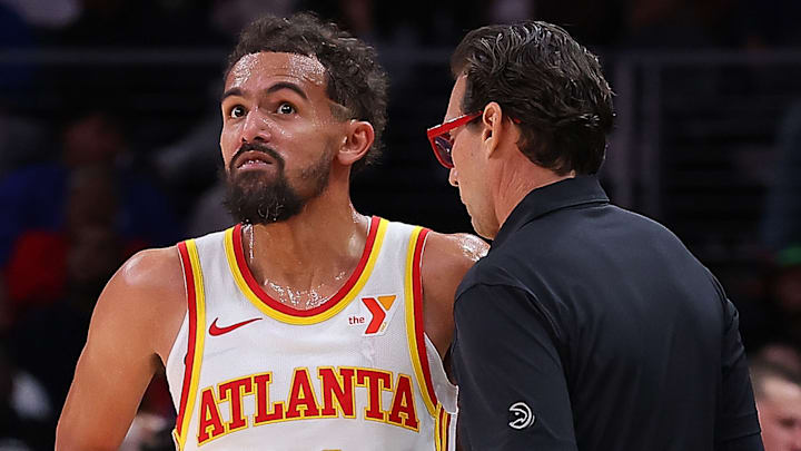 Atlanta Hawks guard Trae Young #11 and head coach Quin Snyder