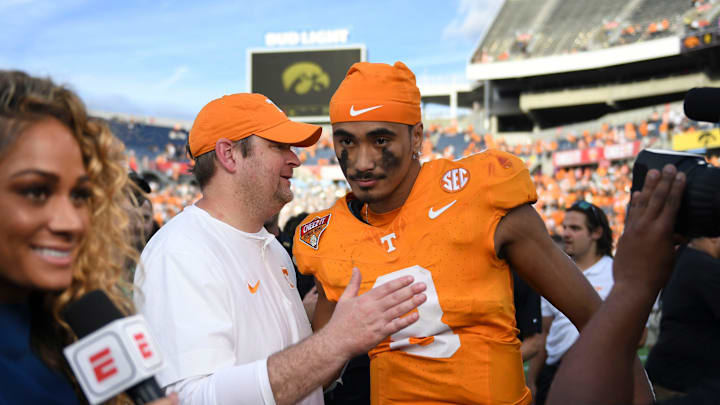 Tennessee head coach Josh Heupel turns to quarterback Nico Iamaleava (8) after their post game interview after winning the Citrus Bowl NCAA College football game on Monday, January 1, 2024 in Orlando, Fla. against Iowa.