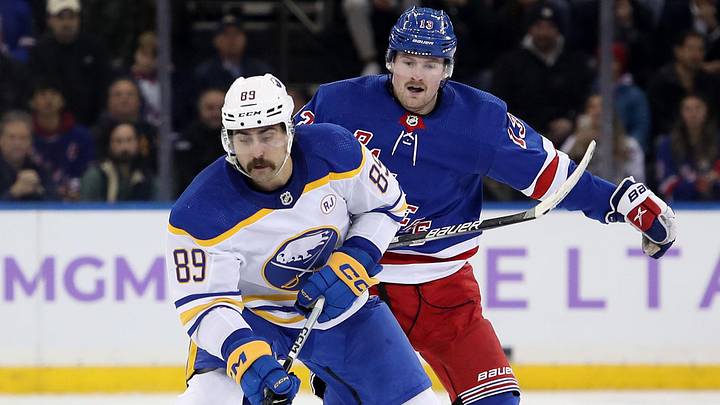 Nov 27, 2023; New York, New York, USA; Buffalo Sabres right wing Alex Tuch (89) skates by New York Rangers forward Alexis Lafreniere (13) during the third period at Madison Square Garden. Nov 27, 2023; New York, New York, USA; Buffalo Sabres right wing Alex Tuch (89) skates by New York Rangers forward Alexis Lafreniere (13) during the third period at Madison Square Garden.