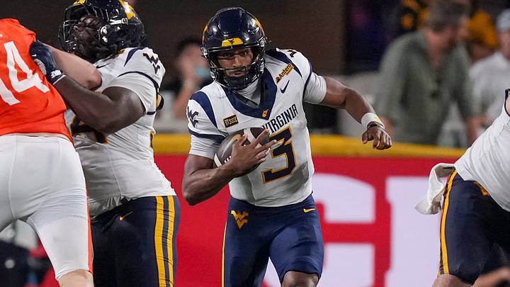 Sep 19, 2026; Charlotte, North Carolina, USA; West Virginia Mountaineers quarterback Michael Hawkins Jr. (3) scrambles for a run out of the pocket during the second half against the Virginia Cavaliers at Bank of America Stadium. Mandatory Credit: Jim Dedmon-Imagn Images Sep 19, 2026; Charlotte, North Carolina, USA; West Virginia Mountaineers quarterback Michael Hawkins Jr. (3) scrambles for a run out of the pocket during the second half against the Virginia Cavaliers at Bank of America Stadium. Mandatory Credit: Jim Dedmon-Imagn Images