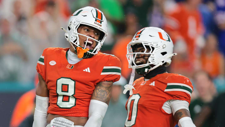 Sep 20, 2025; Miami Gardens, Florida, USA; Miami Hurricanes defensive back Jakobe Thomas (8) defensive back Keionte Scott (0) after sacking Florida Gators quarterback DJ Lagway (not pictured) during the second quarter at Hard Rock Stadium. Mandatory Credit: Sam Navarro-Imagn Images