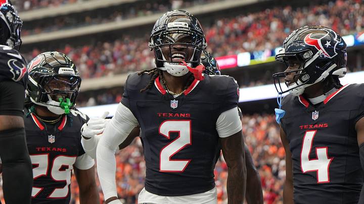 Nov 2, 2025; Houston, Texas, USA; Houston Texans safety Calen Bullock (2) celebrates with safety M.J. Stewart (29) and cornerback Kamari Lassiter (4) after a play during the first half against the Denver Broncos at NRG Stadium. Mandatory Credit: Sean Thomas-Imagn Images