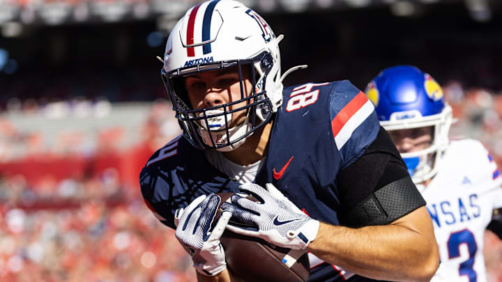 Nov 8, 2025; Tucson, Arizona, USA; Arizona Wildcats tight end Sam Olson (84) catches a touchdown pass against the Kansas Jayhawks in the first half at Arizona Stadium. Mandatory Credit: Mark J. Rebilas-Imagn Images