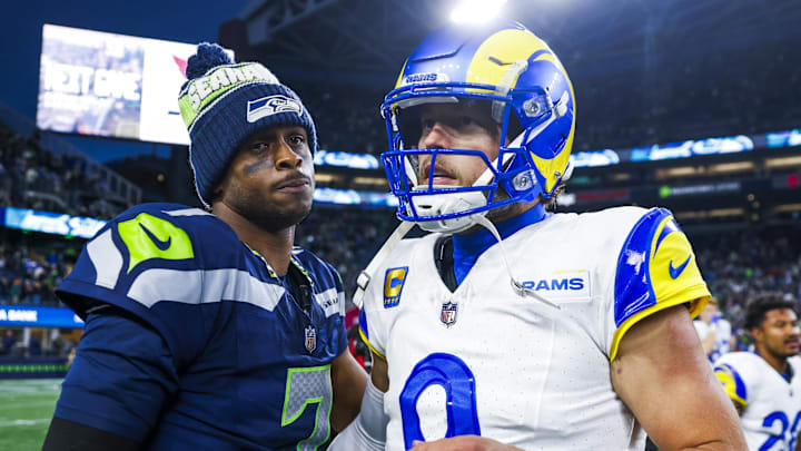 Nov 3, 2024; Seattle, Washington, USA; Seattle Seahawks quarterback Geno Smith (7) and Los Angeles Rams quarterback Matthew Stafford (9) greet each other following an overtime victory by the Rams at Lumen Field. Mandatory Credit: Joe Nicholson-Imagn Images Nov 3, 2024; Seattle, Washington, USA; Seattle Seahawks quarterback Geno Smith (7) and Los Angeles Rams quarterback Matthew Stafford (9) greet each other following an overtime victory by the Rams at Lumen Field. Mandatory Credit: Joe Nicholson-Imagn Images