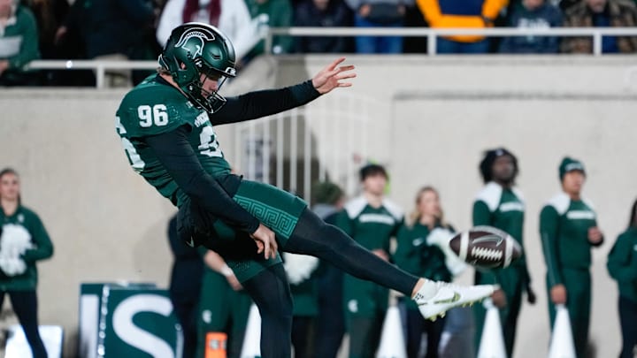 Oct 25, 2025; East Lansing, Michigan, USA; Michigan State Spartans punter Ryan Eckley (96) punts the ball against the Michigan Wolverines during the first half at Spartan Stadium. Mandatory Credit: Brendan Mullin-Imagn Images