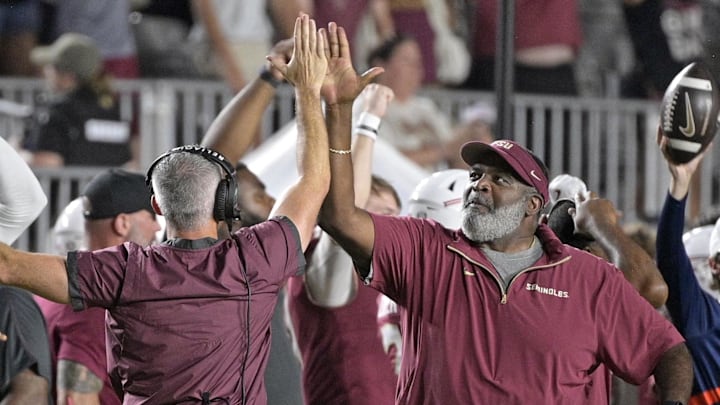 Sep 21, 2024; Tallahassee, Florida, USA; Florida State Seminoles head coach Mike Norvell and associate head coach Odell Haggins high-five after winning against the California Golden Bears at Doak S. Campbell Stadium. Mandatory Credit: Melina Myers-Imagn Images