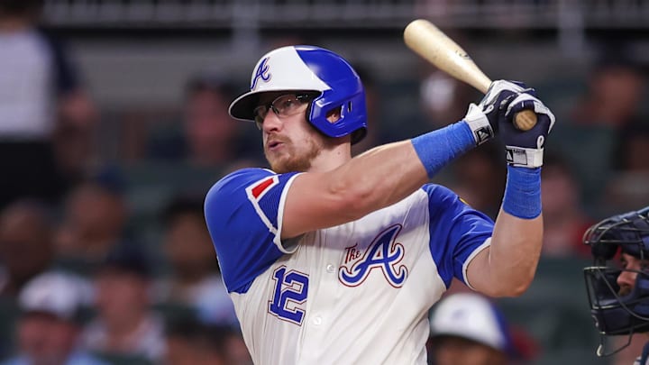 Jul 19, 2025; Atlanta, Georgia, USA; Atlanta Braves catcher Sean Murphy (12) hits a single against the New York Yankees in the fifth inning at Truist Park. Mandatory Credit: Brett Davis-Imagn Images
