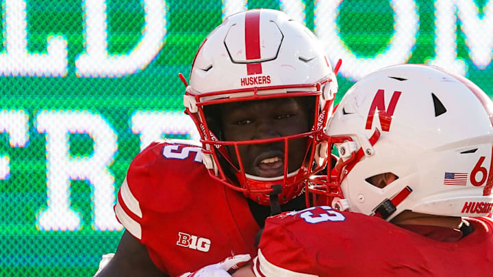 Oct 21, 2023; Lincoln, Nebraska, USA; Nebraska Cornhuskers wide receiver Malachi Coleman (15) and offensive lineman Nouredin Nouili (63) during the fourth quarter against the Northwestern Wildcats at Memorial Stadium. Mandatory Credit: Dylan Widger-Imagn Images