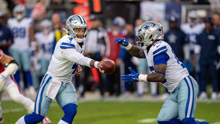 Oct 27, 2024; Santa Clara, California, USA; Dallas Cowboys quarterback Dak Prescott (4) hands off to Dallas Cowboys running back Ezekiel Elliott (15) against the San Francisco 49ers during the first quarter at Levi's Stadium. Mandatory Credit: Neville E. Guard-Imagn Images