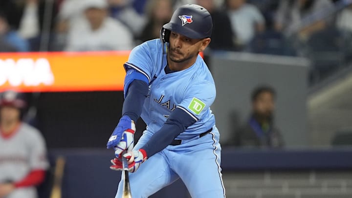 Apr 1, 2025; Toronto, Ontario, CAN; Toronto Blue Jays second baseman Andres Gimenez (0) hits a single against the Washington Nationals during the second inning at Rogers Centre. 