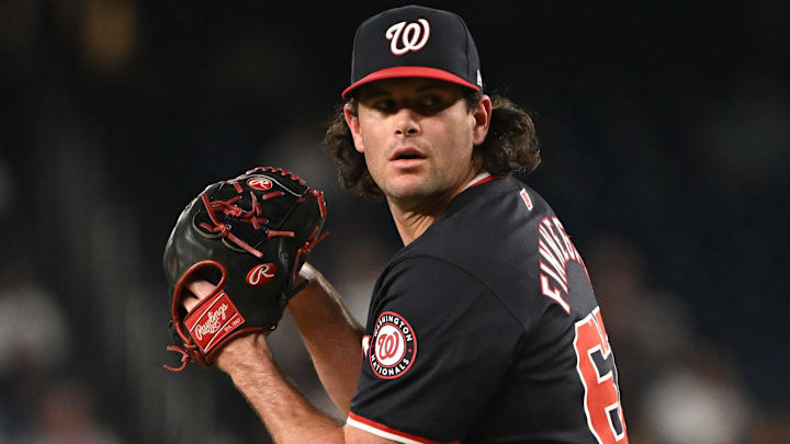 Aug 28, 2024; Washington, District of Columbia, USA; Washington Nationals relief pitcher Kyle Finnegan (67) prepares to throw a pitch against the New York Yankees during the ninth inning at Nationals Park Aug 28, 2024; Washington, District of Columbia, USA; Washington Nationals relief pitcher Kyle Finnegan (67) prepares to throw a pitch against the New York Yankees during the ninth inning at Nationals Park