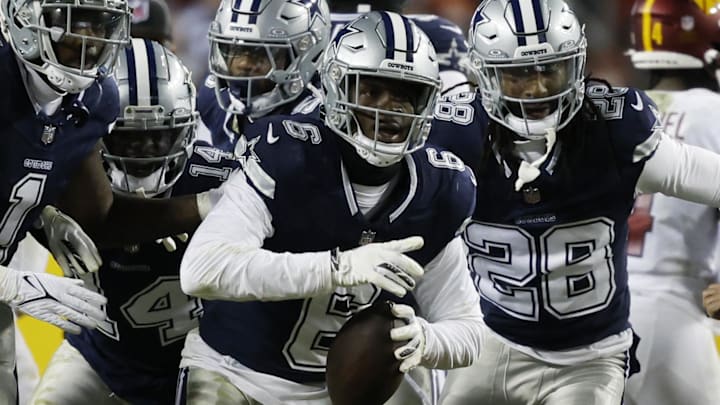 Jan 7, 2024; Landover, Maryland, USA; Dallas Cowboys safety Donovan Wilson (6) celebrates with teammates after intercepting a pass against the Washington Commanders during the second quarter at FedExField. Mandatory Credit: Geoff Burke-Imagn Images