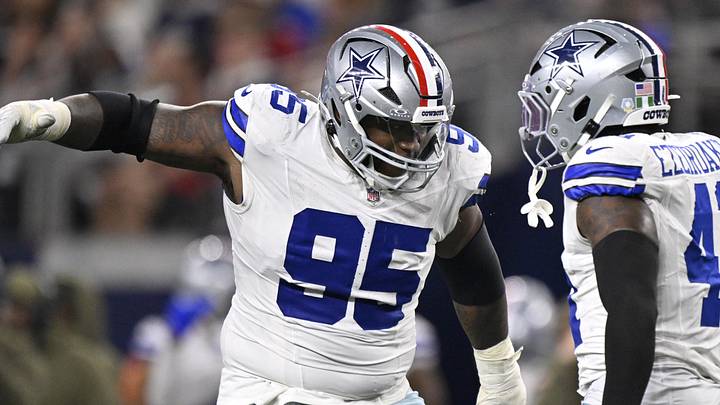Dallas Cowboys defensive tackle Kenny Clark celebrates with Donovan Ezeiruaku after a sack against Arizona Cardinals 