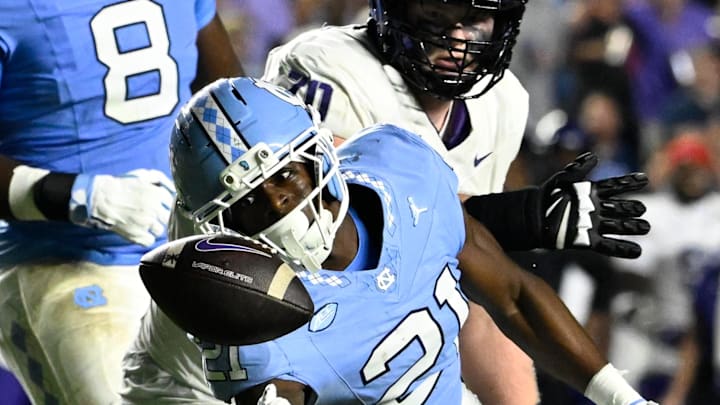 Sep 1, 2025; Chapel Hill, North Carolina, USA; North Carolina Tar Heels defensive back Kaleb Cost (21) intercepts a pass in the second quarter at Kenan Stadium. Mandatory Credit: Bob Donnan-Imagn Images Sep 1, 2025; Chapel Hill, North Carolina, USA; North Carolina Tar Heels defensive back Kaleb Cost (21) intercepts a pass in the second quarter at Kenan Stadium. Mandatory Credit: Bob Donnan-Imagn Images
