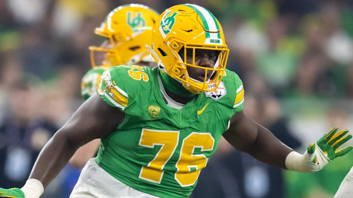 Jan 1, 2024; Glendale, AZ, USA; Oregon Ducks offensive lineman Josh Conerly Jr. (76) against the Liberty Flames during the 2024 Fiesta Bowl at State Farm Stadium. Mandatory Credit: Mark J. Rebilas-Imagn Images