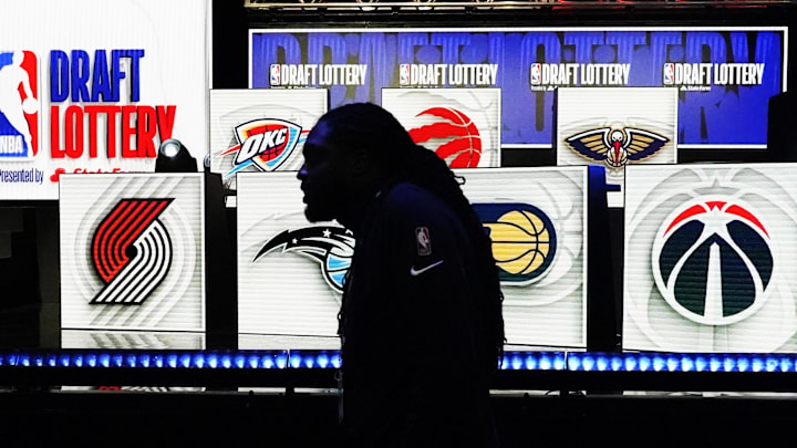 May 16, 2023; Chicago, IL, USA; People walk past the 2023 NBA Draft Lottery board at McCormick Place West. Mandatory Credit: David Banks-Imagn Images