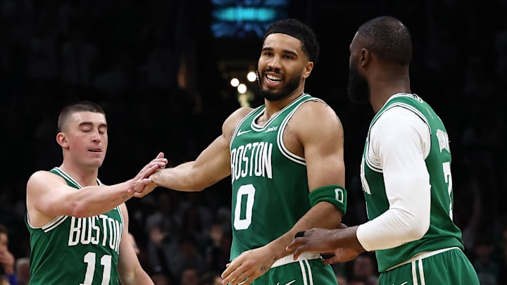 Mar 6, 2026; Boston, Massachusetts, USA; Boston Celtics forward Jayson Tatum (0) smiles at Boston Celtics guard Jaylen Brown (7) while being congratulated by guard Payton Pritchard (11) during the second half at TD Garden. Mandatory Credit: Winslow Townson-Imagn Images