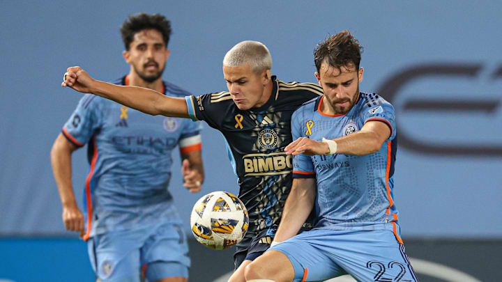 Sep 18, 2024; Bronx, New York, USA;  New York City FC forward Kevin O'Toole (22) battle for the ball against Philadelphia Union midfielder Cavan Sullivan (6) during the second half at Yankee Stadium. Mandatory Credit: Vincent Carchietta-Imagn Images