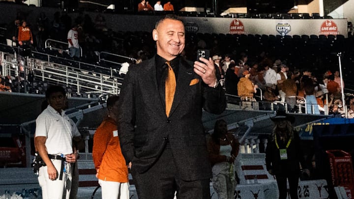 Texas football head coach Steve Sarkisian walks the field ahead of the game as the Longhorns prepare to play the Ohio State Buckeyes in the Cotton Bowl.