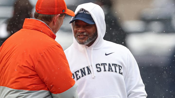 Dec 27, 2025; Bronx, NY, USA; Clemson Tigers head coach Dabo Swinney, left, talks with Penn State Nittany Lions interim head coach Terry Smith before the 2025 Pinstripe Bowl at Yankee Stadium. Mandatory Credit: Vincent Carchietta-Imagn Images