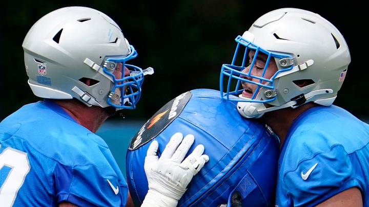 Dan Skipper, left, works out with his former teammate Giovanni Manu 