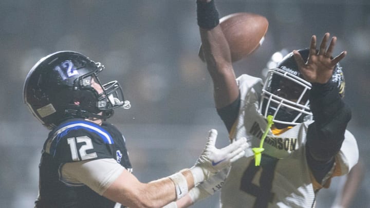 Williamson's Jaylen Scott (4) breaks up a pass intended for Montgomery Catholic's Michael Sheffield (12) during the AHSAA football playoffs at Montgomery Preparatory School in Montgomery, Ala. on Friday, Nov. 21, 2025. Montgomery Catholic leads Williamson 10-7 at halftime.