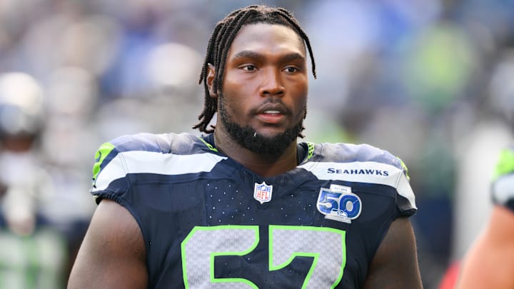 Seattle Seahawks offensive tackle Charles Cross (67) looks on from the sideline during the third quarter against the New Orleans Saints at Lumen Field.