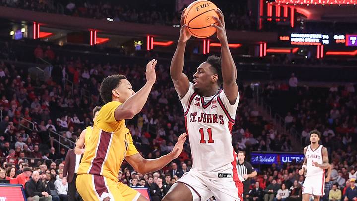 Dec 13, 2025; Queens, New York, USA; St. John's Red Storm guard Ian Jackson (11) looks to drive past Iona Gaels guard Denver Anglin (2) in the second half at Madison Square Garden. Mandatory Credit: Wendell Cruz-Imagn Images Dec 13, 2025; Queens, New York, USA; St. John's Red Storm guard Ian Jackson (11) looks to drive past Iona Gaels guard Denver Anglin (2) in the second half at Madison Square Garden. Mandatory Credit: Wendell Cruz-Imagn Images