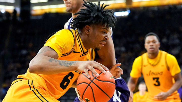 Iowa’s Tavion Banks (6) drives toward the basket against Northwestern forward Tre Singleton (8) Feb. 8, 2026 at Carver-Hawkeye Arena in Iowa City, Iowa. Iowa’s Tavion Banks (6) drives toward the basket against Northwestern forward Tre Singleton (8) Feb. 8, 2026 at Carver-Hawkeye Arena in Iowa City, Iowa.