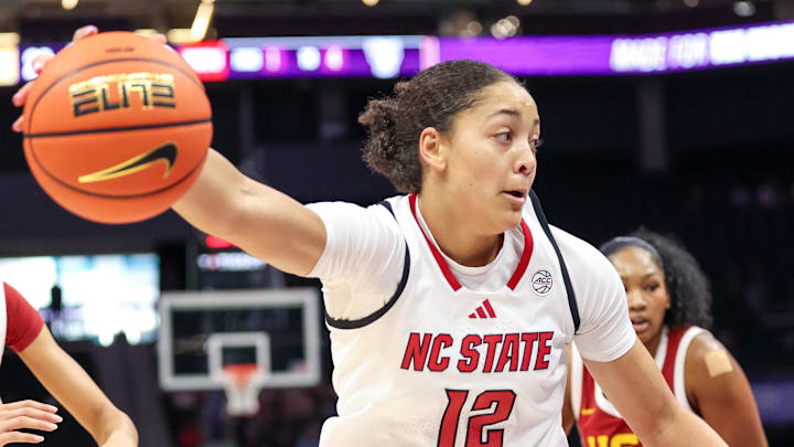 Nov 9, 2025; Charlotte, North Carolina, USA; NC State Wolfpack forward Khamil Pierre (12) controls the ball against the Southern California Trojans during the second quarter of the Ally Tipoff game at Spectrum Center. Mandatory Credit: Cory Knowlton-Imagn Images Nov 9, 2025; Charlotte, North Carolina, USA; NC State Wolfpack forward Khamil Pierre (12) controls the ball against the Southern California Trojans during the second quarter of the Ally Tipoff game at Spectrum Center. Mandatory Credit: Cory Knowlton-Imagn Images