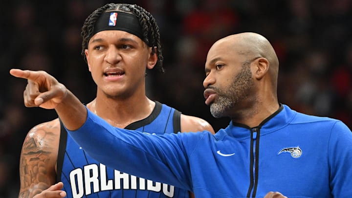 Dec 3, 2022; Toronto, Ontario, CAN;  Orlando Magic head coach Jamahl Mosley speaks to forward Paolo Banchero (5) in the first half against the Toronto Raptors at Scotiabank Arena. Mandatory Credit: Dan Hamilton-Imagn Images