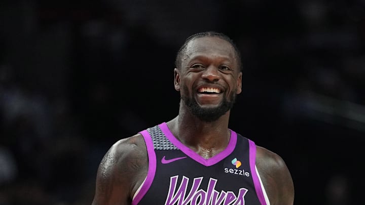 Feb 24, 2026; Portland, Oregon, USA; Minnesota Timberwolves forward Julius Randle (30) and Portland Trail Blazers guard Jrue Holiday (5) share a laugh during the second half at Moda Center. Mandatory Credit: Soobum Im-Imagn Images