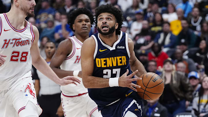 Dec 15, 2025; Denver, Colorado, USA; Denver Nuggets guard Jamal Murray (27) drives to the net past Houston Rockets center Alperen Sengun (28) in overtime at Ball Arena. Mandatory Credit: Ron Chenoy-Imagn Images Dec 15, 2025; Denver, Colorado, USA; Denver Nuggets guard Jamal Murray (27) drives to the net past Houston Rockets center Alperen Sengun (28) in overtime at Ball Arena. Mandatory Credit: Ron Chenoy-Imagn Images
