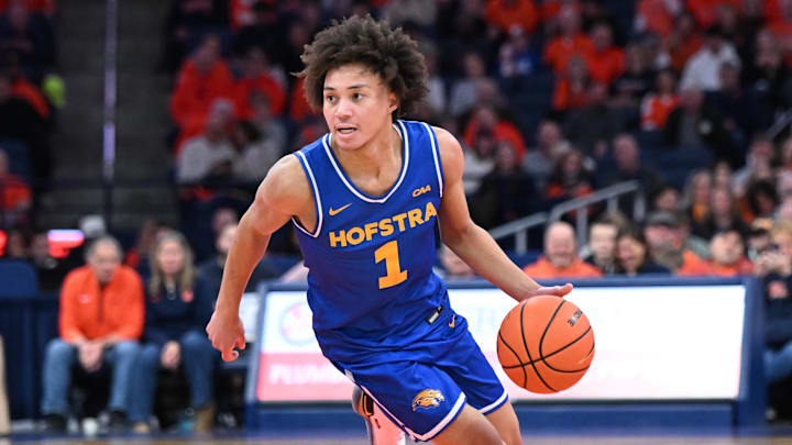 Dec 13, 2025; Syracuse, New York, USA; Hofstra Pride guard Preston Edmead (1) dribbles against the Syracuse Orange in the first half at the JMA Wireless Dome. Mandatory Credit: Mark Konezny-Imagn Images