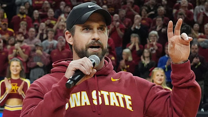 Iowa State football coach Jimmy Rogers speaks during a timeout in the Cy-Hawk men's basketball game on Dec. 11, 2025, at Hilton Coliseum in Ames.