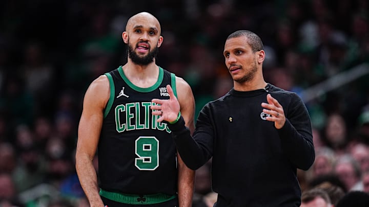 Mar 1, 2024; Boston, Massachusetts, USA; Boston Celtics head coach Joe Mazzulla talks with guard Derrick White (9) from the sideline as they take on the Dallas Mavericks at TD Garden. Mandatory Credit: David Butler II-Imagn Images