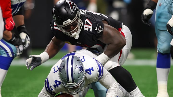 Nov 3, 2024; Atlanta, Georgia, USA; Atlanta Falcons defensive end Grady Jarrett (97) sacks Dallas Cowboys quarterback Dak Prescott (4) in the first quarter at Mercedes-Benz Stadium. Mandatory Credit: Brett Davis-Imagn Images