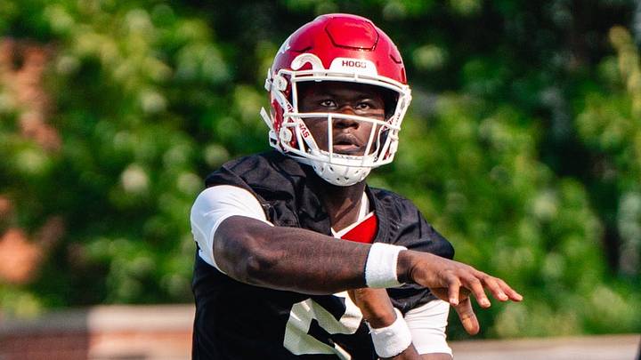 Arkansas Razorbacks quarterback AJ Hill attempts pass during fall camp Arkansas Razorbacks quarterback AJ Hill attempts pass during fall camp