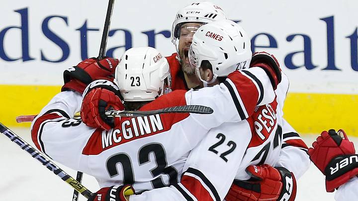 Apr 24, 2019; Washington, DC, USA; Carolina Hurricanes left wing Brock McGinn (23) celebrates with Hurricanes defenseman Brett Pesce (22) and Hurricanes right wing Justin Williams (14) after scoring the game-winning goal against the Washington Capitals in the second overtime in game seven of the first round of the 2019 Stanley Cup Playoffs at Capital One Arena. The Hurricanes won 4-3 in double overtime. Mandatory Credit: Geoff Burke-USA TODAY Sports Apr 24, 2019; Washington, DC, USA; Carolina Hurricanes left wing Brock McGinn (23) celebrates with Hurricanes defenseman Brett Pesce (22) and Hurricanes right wing Justin Williams (14) after scoring the game-winning goal against the Washington Capitals in the second overtime in game seven of the first round of the 2019 Stanley Cup Playoffs at Capital One Arena. The Hurricanes won 4-3 in double overtime. Mandatory Credit: Geoff Burke-USA TODAY Sports