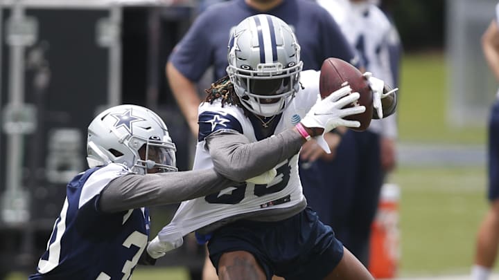 Dallas Cowboys wide receiver CeeDee Lamb catches a pass against cornerback Anthony Brown during OTAs at The Star Dallas Cowboys wide receiver CeeDee Lamb catches a pass against cornerback Anthony Brown during OTAs at The Star