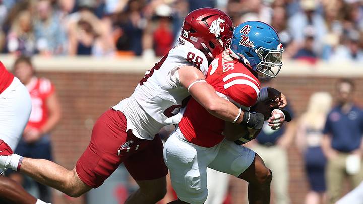 Oct 11, 2025; Oxford, Mississippi, USA; Washington State Cougars defensive end Isaac Terrell (88) forces Mississippi Rebels quarterback Trinidad Chambliss (6) to fumble during the second quarter at Vaught-Hemingway Stadium. Oct 11, 2025; Oxford, Mississippi, USA; Washington State Cougars defensive end Isaac Terrell (88) forces Mississippi Rebels quarterback Trinidad Chambliss (6) to fumble during the second quarter at Vaught-Hemingway Stadium.