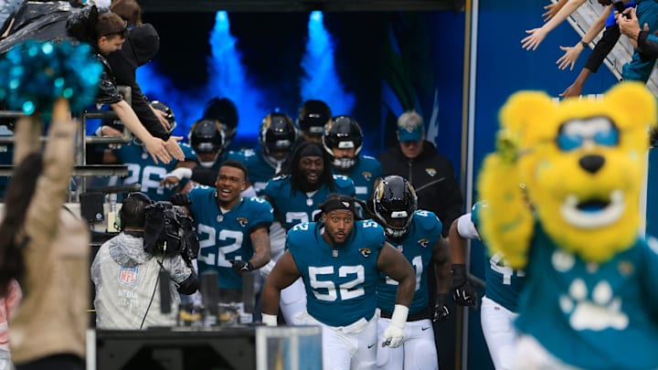 Jacksonville Jaguars defensive tackle DaVon Hamilton (52) leads the team onto the field before an NFL football matchup Sunday, Dec. 29, 2024 at EverBank Stadium in Jacksonville, Fla. The Jaguars held off the Titans 20-13. [Corey Perrine/Florida Times-Union]