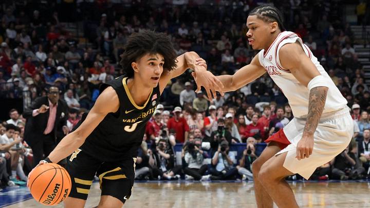 Vanderbilt Commodores guard Tyler Tanner (3) drives to the basket defended by Arkansas Razorbacks guard Darius Acuff Jr. (5) in the second half during the men's SEC Conference Tournament Championship at Bridgestone Arena. 